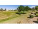 Scenic view of the golf course with mature trees and manicured grass, perfect for outdoor enthusiasts at 7649 Broadwing Dr, North Las Vegas, NV 89084