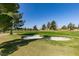 Picturesque golf course featuring lush green fairways, mature trees, and a sand trap at 7649 Broadwing Dr, North Las Vegas, NV 89084
