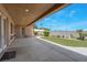 Covered back patio with concrete pad and artificial turf at 7668 Friendly Breeze Ct, Las Vegas, NV 89123