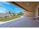 Open back patio with concrete pad and artificial turf at 7668 Friendly Breeze Ct, Las Vegas, NV 89123