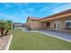 Landscaped backyard with pool and covered patio at 7668 Friendly Breeze Ct, Las Vegas, NV 89123