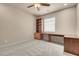 Inviting bedroom featuring an built-in desk and ample storage cabinets, perfect for work or study at 7668 Friendly Breeze Ct, Las Vegas, NV 89123