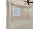 Comfortable bedroom with plush carpeting, neutral walls, and bright window, a peaceful sanctuary at 7668 Friendly Breeze Ct, Las Vegas, NV 89123