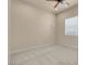 Cozy bedroom with carpet, ceiling fan, and natural light from a window at 7668 Friendly Breeze Ct, Las Vegas, NV 89123