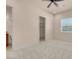 Neutral bedroom featuring a ceiling fan, plush carpeting, and a walk-in closet entrance at 7668 Friendly Breeze Ct, Las Vegas, NV 89123