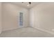 Spacious bedroom featuring carpet, access to the outside and natural lighting at 7668 Friendly Breeze Ct, Las Vegas, NV 89123