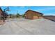 Detached garage with long driveway and basketball hoop at 7668 Friendly Breeze Ct, Las Vegas, NV 89123