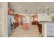 Gourmet kitchen featuring granite countertops, pendant lighting, stainless appliances, and custom cabinetry at 7668 Friendly Breeze Ct, Las Vegas, NV 89123