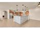 Bright, spacious kitchen with a large island and stainless steel appliances at 7668 Friendly Breeze Ct, Las Vegas, NV 89123