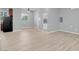 The living room features modern flooring, neutral paint, and lots of natural light at 7668 Friendly Breeze Ct, Las Vegas, NV 89123