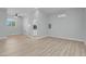 Open living room with laminate flooring and gray walls at 7668 Friendly Breeze Ct, Las Vegas, NV 89123