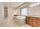 Luxurious main bathroom with a large soaking tub and dual vanities at 7668 Friendly Breeze Ct, Las Vegas, NV 89123