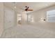 Spacious main bedroom with neutral carpet and natural light at 7668 Friendly Breeze Ct, Las Vegas, NV 89123