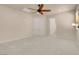 Bright main bedroom features a neutral carpet and view to bathroom at 7668 Friendly Breeze Ct, Las Vegas, NV 89123