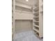 Spacious walk-in closet featuring custom shelving and ample storage space at 7668 Friendly Breeze Ct, Las Vegas, NV 89123