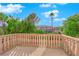 Balcony view showcasing lush greenery, beautiful sky and neighborhood homes at 807 Canyon Greens Dr, Las Vegas, NV 89144