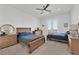 Bright bedroom with two beds, ceiling fan, tray ceiling and balcony access at 807 Canyon Greens Dr, Las Vegas, NV 89144