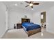 Bright bedroom featuring a bed, tile floors, neutral color palette, and en-suite bathroom at 807 Canyon Greens Dr, Las Vegas, NV 89144