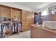 Spacious walk-in closet with custom wood shelving, drawers, and a central island for organization at 807 Canyon Greens Dr, Las Vegas, NV 89144