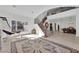 Bright foyer featuring a staircase with wrought iron details, and natural light from a large window at 807 Canyon Greens Dr, Las Vegas, NV 89144