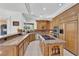 Spacious kitchen showcasing granite counters, stainless steel appliances, custom cabinets, and a functional kitchen island at 807 Canyon Greens Dr, Las Vegas, NV 89144