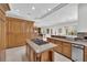Expansive kitchen with a large center island, custom cabinetry, and granite countertops provides ample workspace at 807 Canyon Greens Dr, Las Vegas, NV 89144