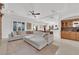 Spacious living room has a large sectional couch, bar area and recessed lighting at 807 Canyon Greens Dr, Las Vegas, NV 89144