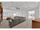 Spacious upstairs living area with abundant natural light and comfortable sectional seating at 807 Canyon Greens Dr, Las Vegas, NV 89144