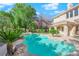 Backyard with beautiful pool, spa and tropical landscaping at 807 Canyon Greens Dr, Las Vegas, NV 89144