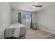 Neutral bedroom featuring a ceiling fan and window allowing natural light at 823 Cherry Dr, Henderson, NV 89002