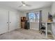 Bedroom with wood-look flooring, closet, a ceiling fan, and a window at 823 Cherry Dr, Henderson, NV 89002