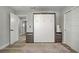 Cozy bedroom featuring a Murphy bed, bedside tables, and a closet with sliding doors at 823 Cherry Dr, Henderson, NV 89002