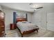 Comfortable bedroom showcasing wood-look flooring, closet, and dark wood furnishings at 823 Cherry Dr, Henderson, NV 89002