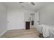 Bedroom features wood-look flooring, a ceiling fan, and a closet with sliding doors at 823 Cherry Dr, Henderson, NV 89002