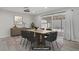 Bright dining area with modern furniture, decor, and sliding glass doors to the backyard at 823 Cherry Dr, Henderson, NV 89002