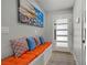 Stylish entryway with a built-in bench, decorative pillows, and modern door design at 823 Cherry Dr, Henderson, NV 89002