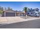 Street view of a quaint one-story home with desert landscaping and RV parking on a sunny day at 823 Cherry Dr, Henderson, NV 89002