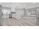 Modern kitchen featuring white cabinets, stainless steel appliances, and an open floor plan at 823 Cherry Dr, Henderson, NV 89002