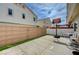 Fenced backyard featuring a basketball hoop and patio furniture at 8801 Duncan Barrel Ave # 103, Las Vegas, NV 89178