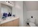 Half bathroom with vanity, sink, and toilet at 8801 Duncan Barrel Ave # 103, Las Vegas, NV 89178