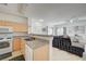 Open concept kitchen flowing into the living room with a breakfast bar at 8801 Duncan Barrel Ave # 103, Las Vegas, NV 89178