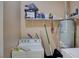 Laundry room featuring washer, dryer, water heater, and ample storage space at 8801 Duncan Barrel Ave # 103, Las Vegas, NV 89178