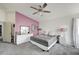 Large bedroom with carpet flooring, ceiling fan, and natural light at 8801 Duncan Barrel Ave # 103, Las Vegas, NV 89178