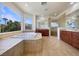 Bright bathroom with a soaking tub, a separate shower, and tile flooring at 9319 Bronze River Ave, Las Vegas, NV 89149