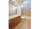 Bathroom with vanity, tile floors, and shower and tub combination at 9319 Bronze River Ave, Las Vegas, NV 89149