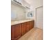 Bathroom featuring double sink vanity, and warm neutral color palette at 9319 Bronze River Ave, Las Vegas, NV 89149