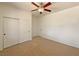 Bedroom with neutral carpet, ceiling fan, and closet at 9319 Bronze River Ave, Las Vegas, NV 89149
