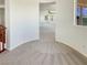 Hallway landing with plush carpeting overlooking the living room at 9319 Bronze River Ave, Las Vegas, NV 89149