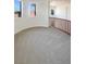 Hallway landing features plush carpeting and traditional wood banister at 9319 Bronze River Ave, Las Vegas, NV 89149