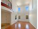 Bright living room featuring hardwood floors, high ceilings, and natural light from multiple windows at 9319 Bronze River Ave, Las Vegas, NV 89149